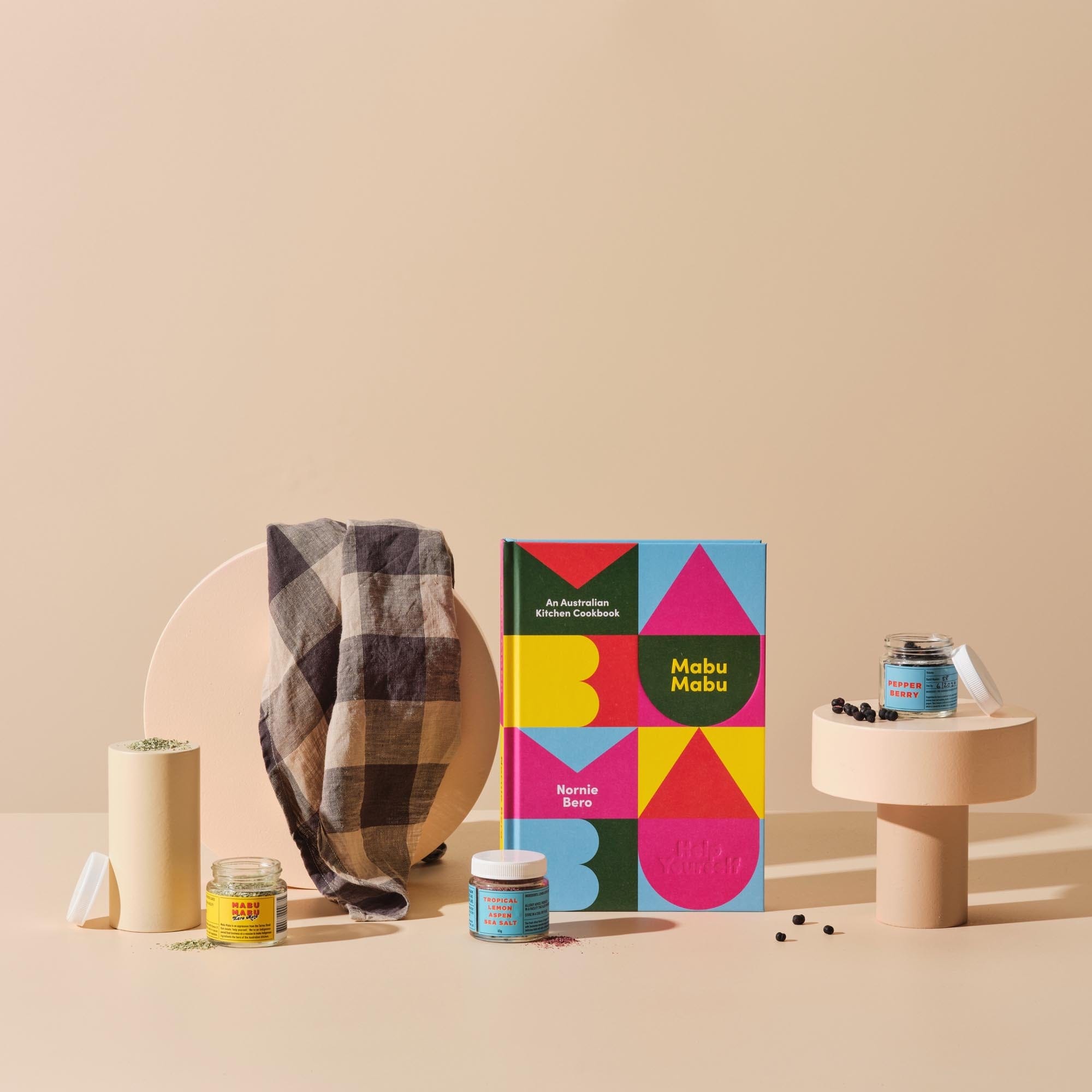 This image features Handsel’s gifting bundle ‘The Native Plate’ that includes: the cover of Mabu Mabu, selection of indigenous spices and Carlotta and Gee’s Linen Tea Towel.