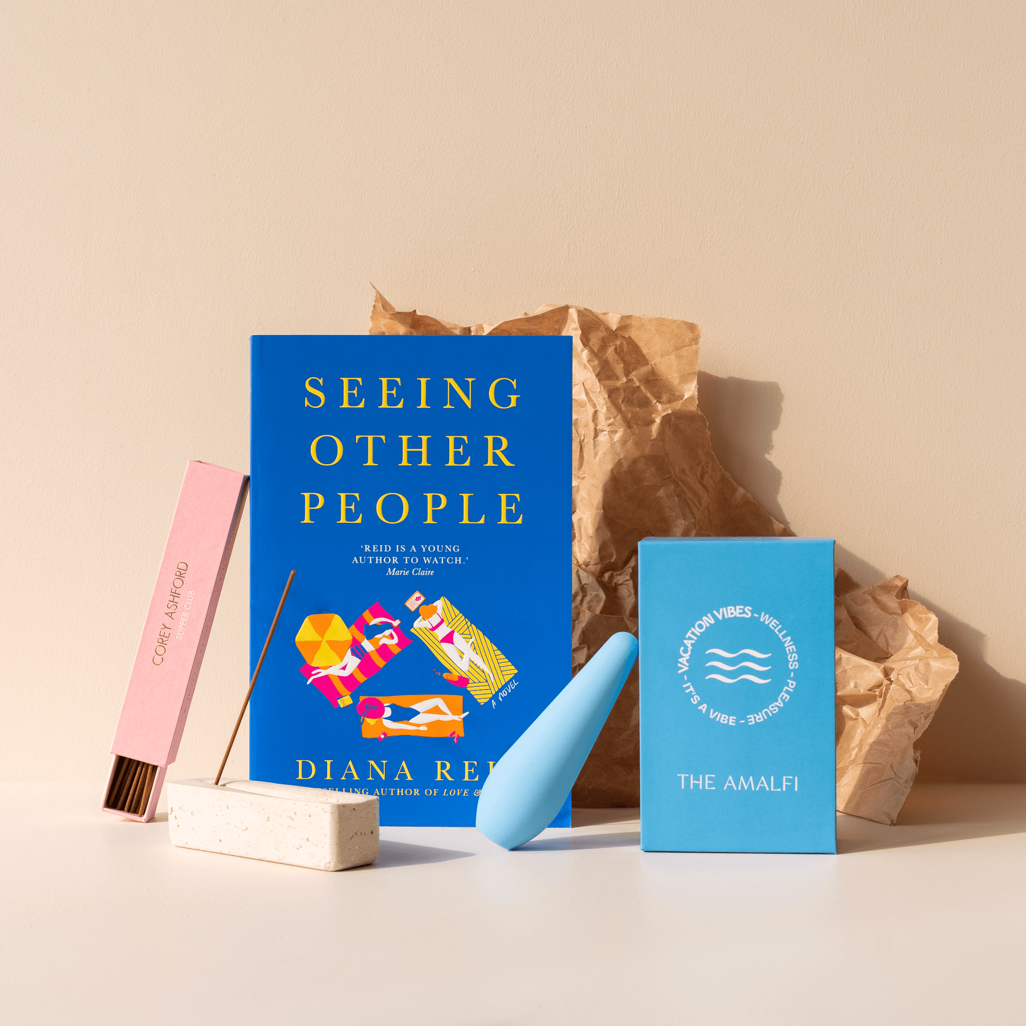 This image features novel, Seeing Other People by Diana Reid, as well as our Vacation Vibes Vibrator and Corey Ashford incense on our incense holder. 