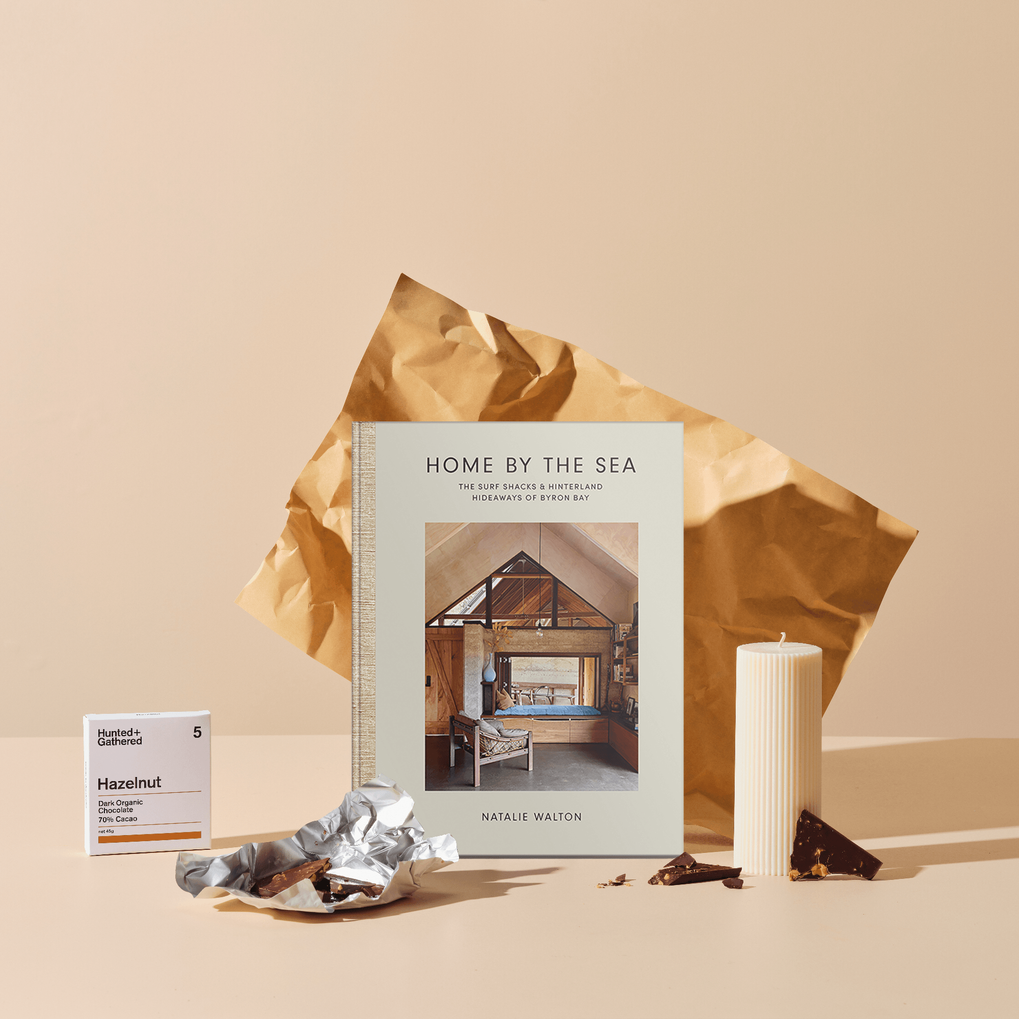 Our regular size, Happy Place gift hamper featuring our Home by the Sea by Natalie Walton, Pillar Candle and Hazelnut Chocolate. 